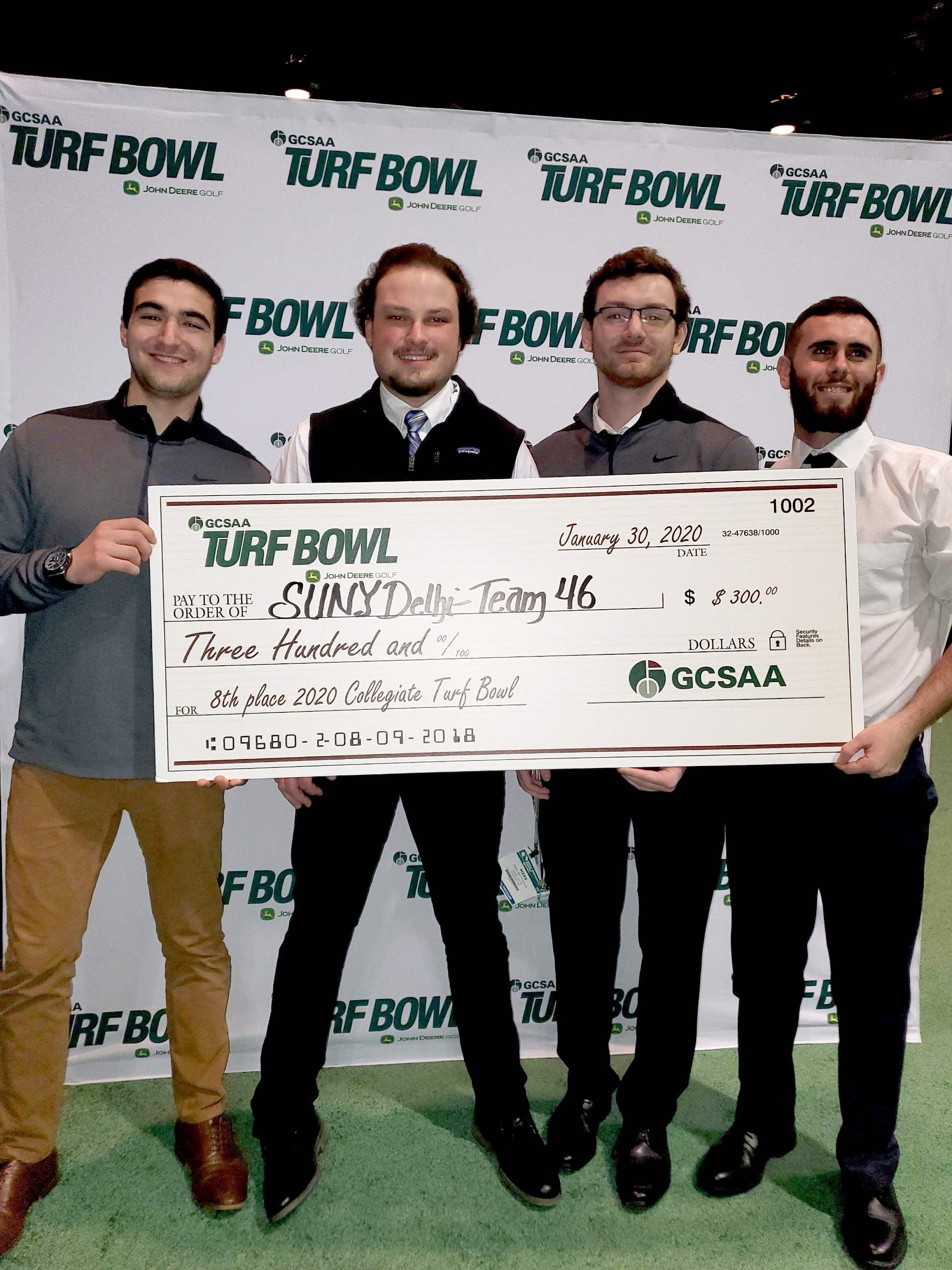 Students holding an oversized check