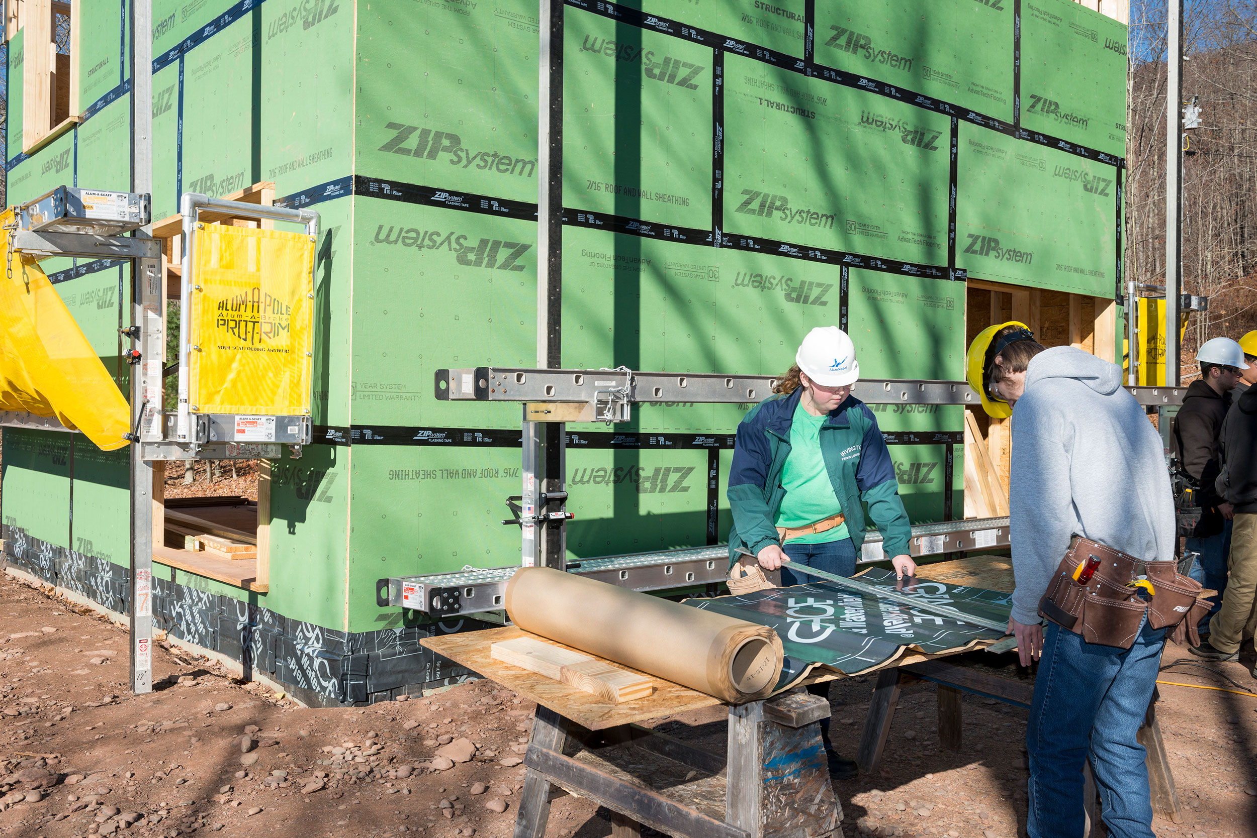 Workers outside of a building being constructed