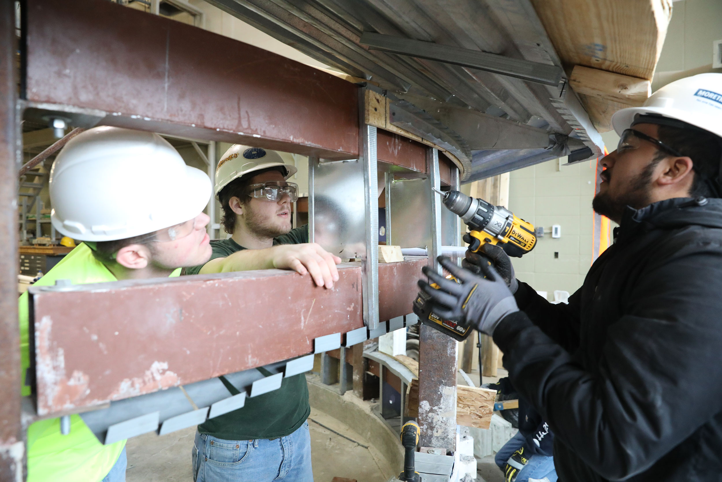Students building a wall