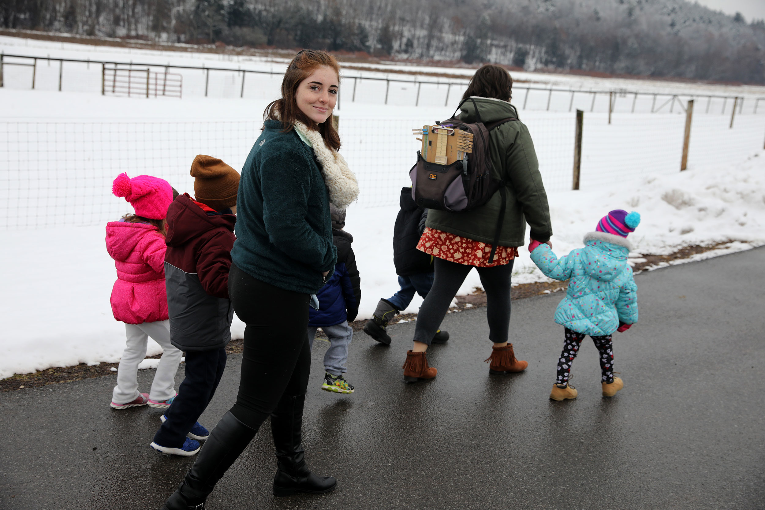 Adults and children walking
