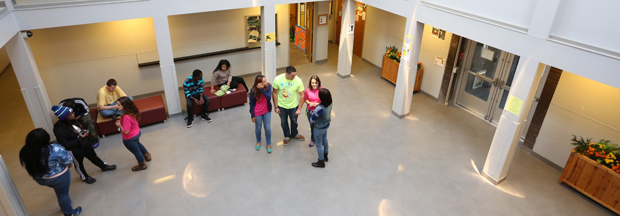 Students socializing in the entrance to Catskill Hall