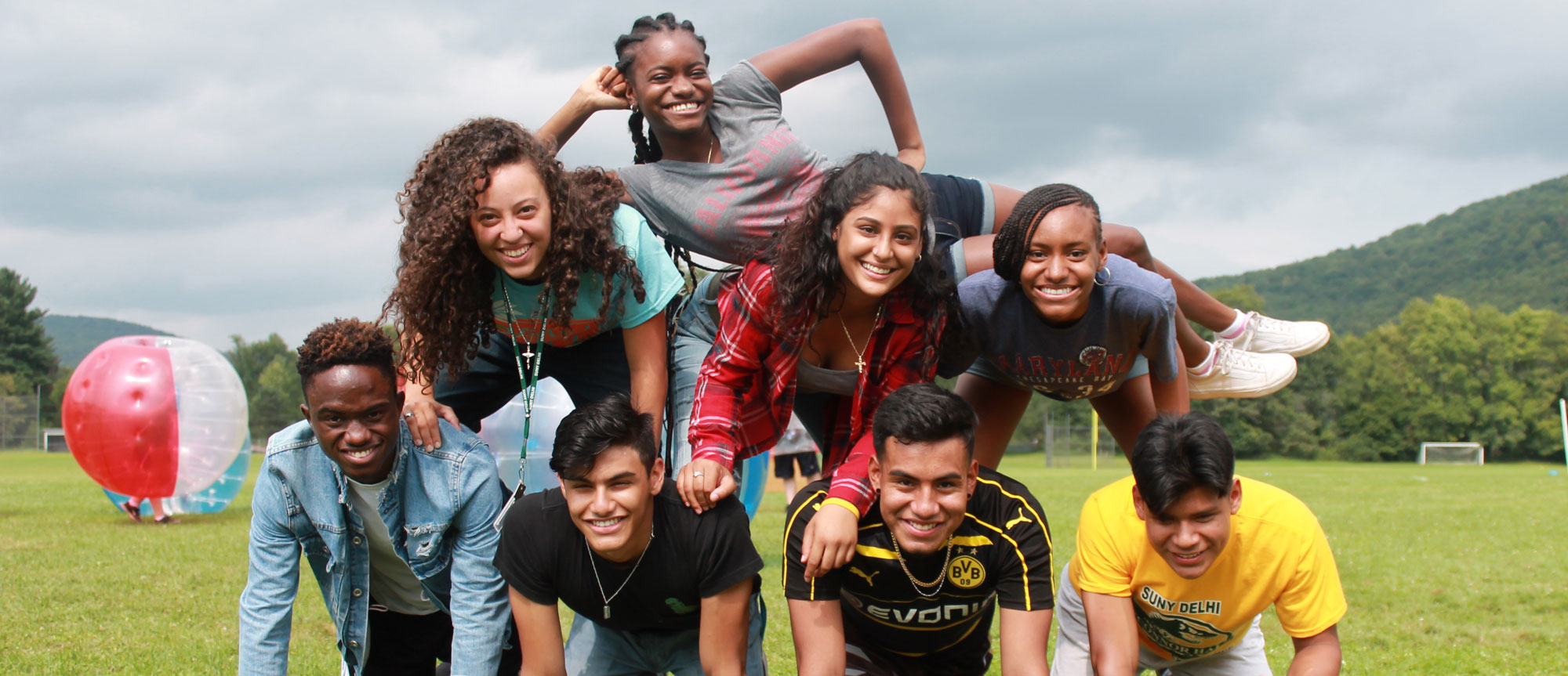 Kids forming a human pyramid