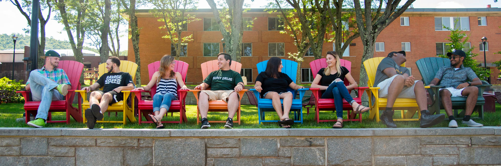 Kids sitting on colorful chairs