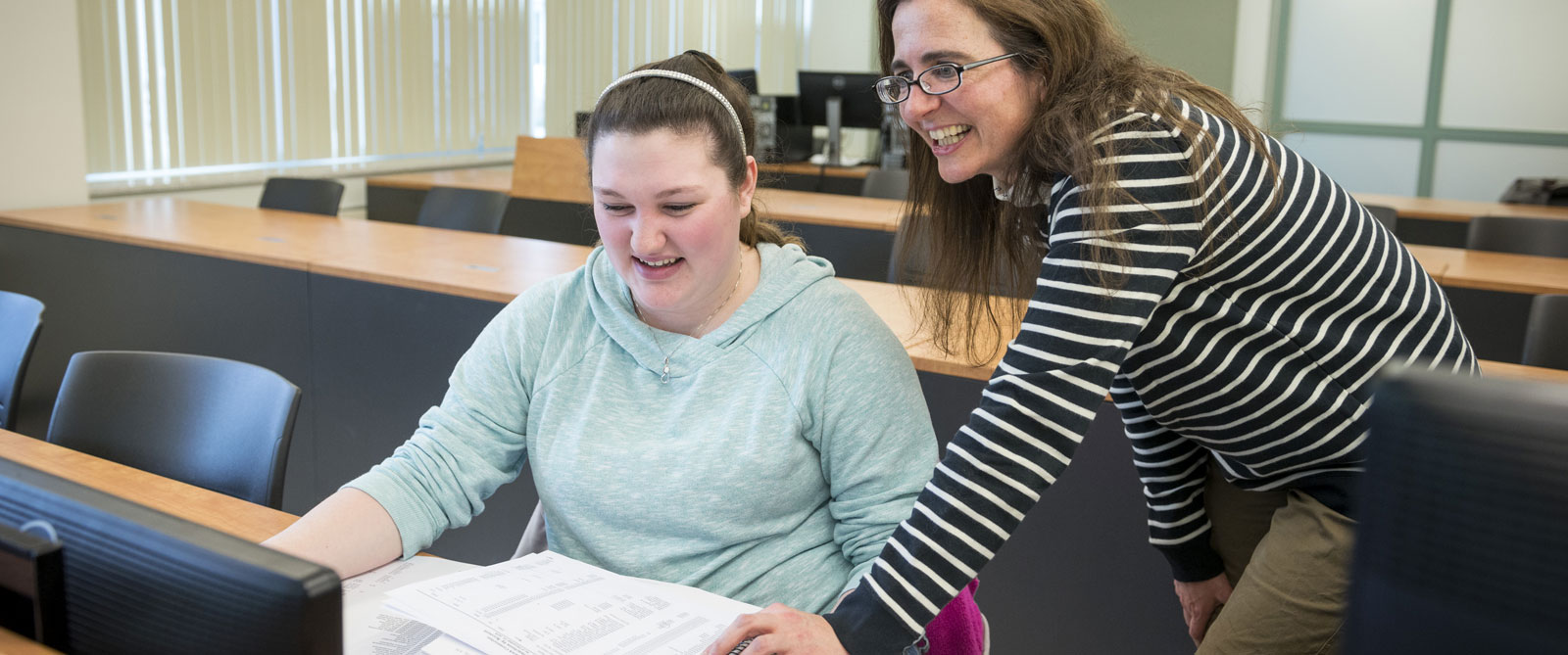 Student and professor reviewing class work