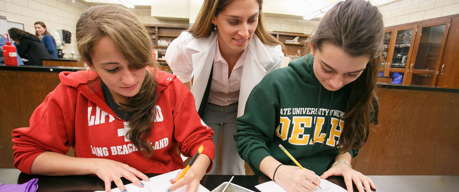 Students working with a professor