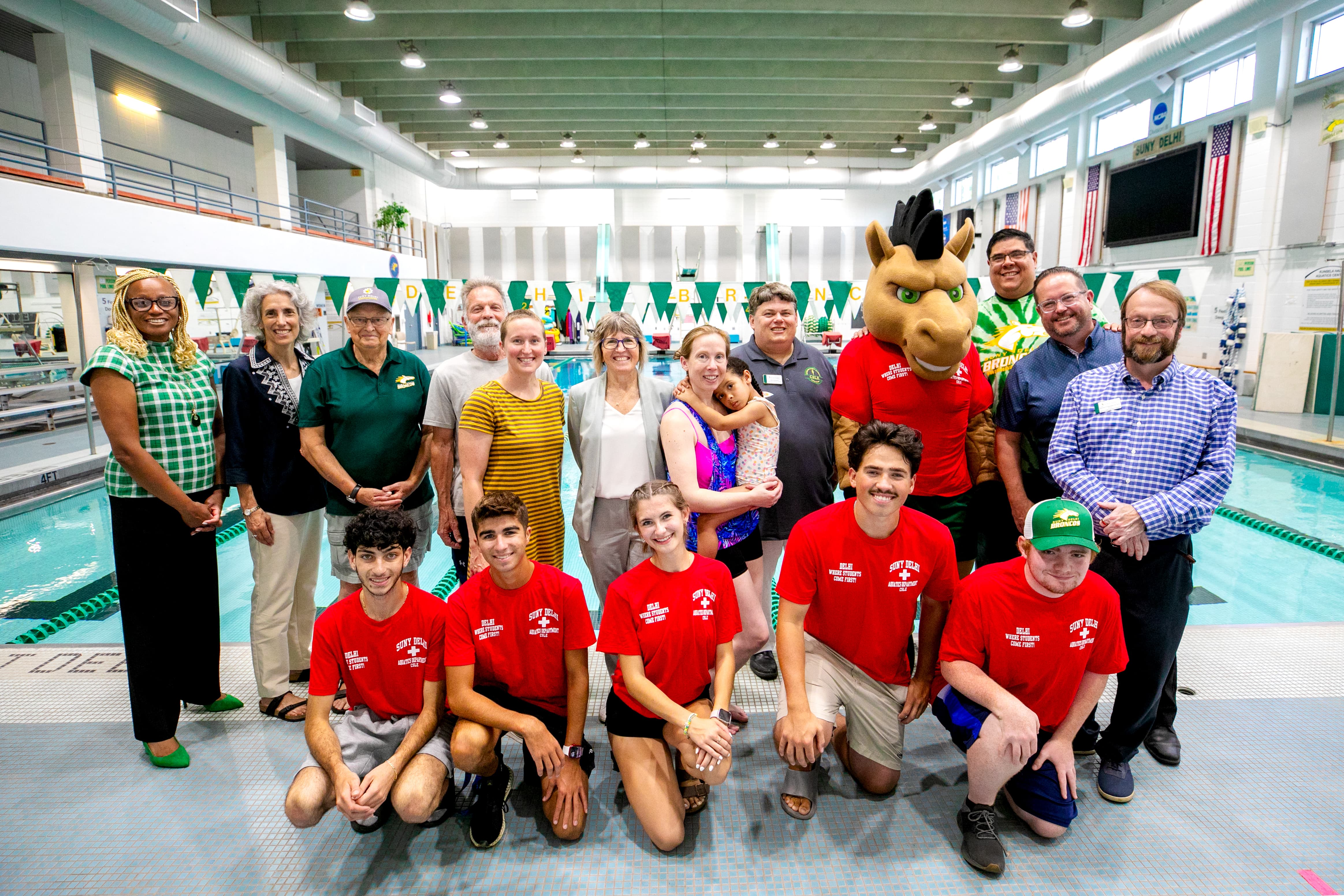 Members of the SUNY Delhi community, including President Mary Bonderoff and student lifeguards, celebrate the impact of the NY SWIMS Grant and the Kunsela Pool on campus.