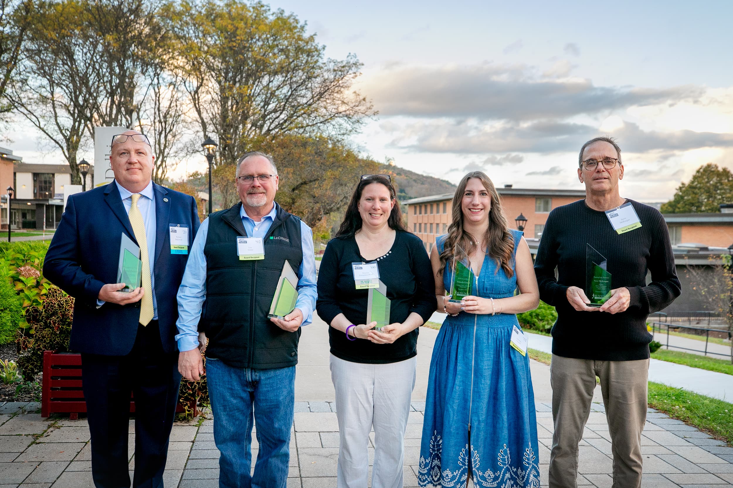 5 People Holding Awards