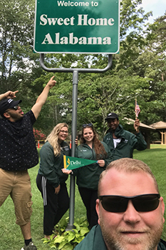 Instructor in front of Alabama sign