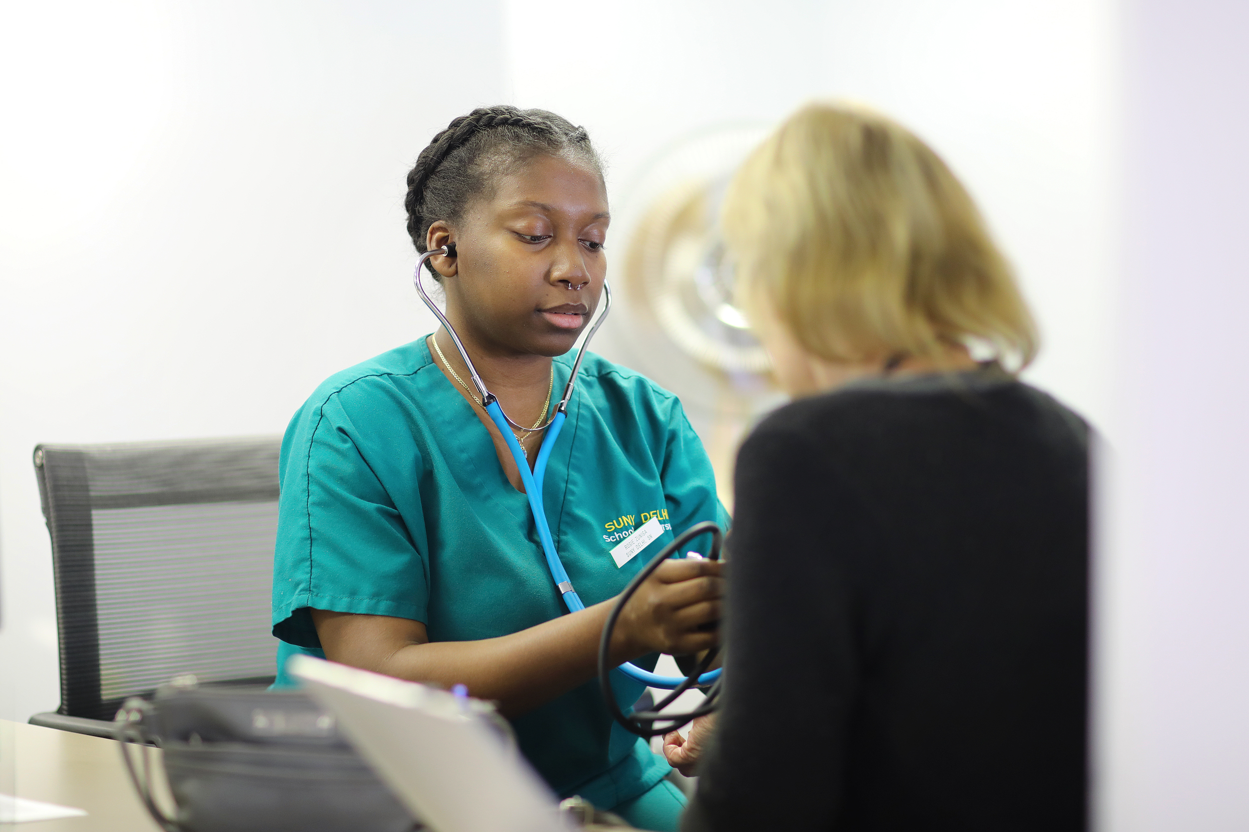 Delhi Nursing student examining a patient