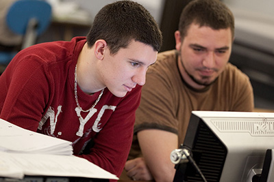Two students working at computer