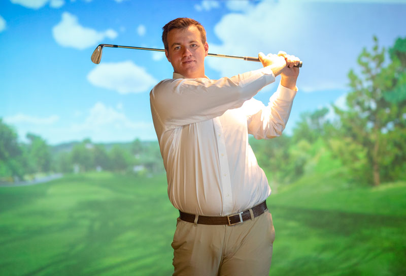 Alum Ryan Florack swinging golf club
