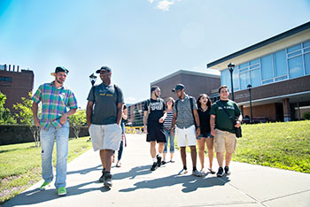 Student walking the SUNY Delhi Campus