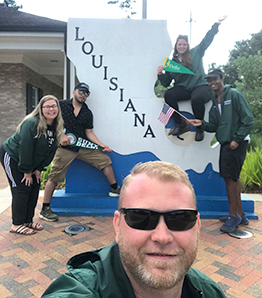 Sean Perhsson in front of Louisianna State sign