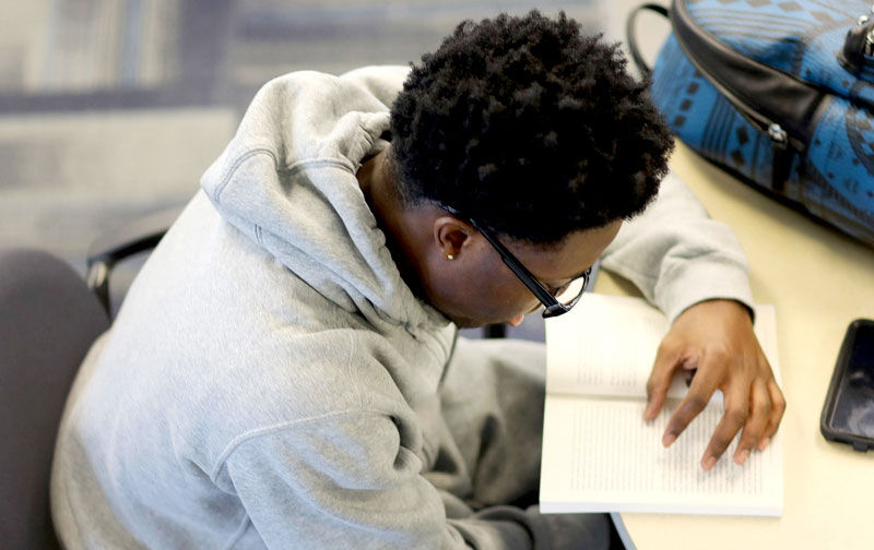 Student reading a book