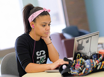 Student at laptop doing coursework