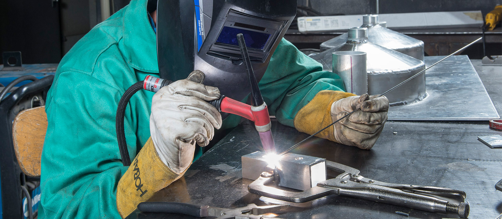 Student welding in lab