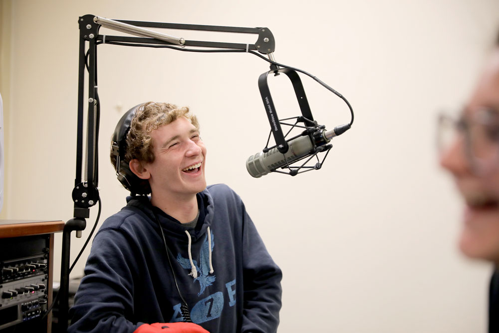 Student laughing with microphone