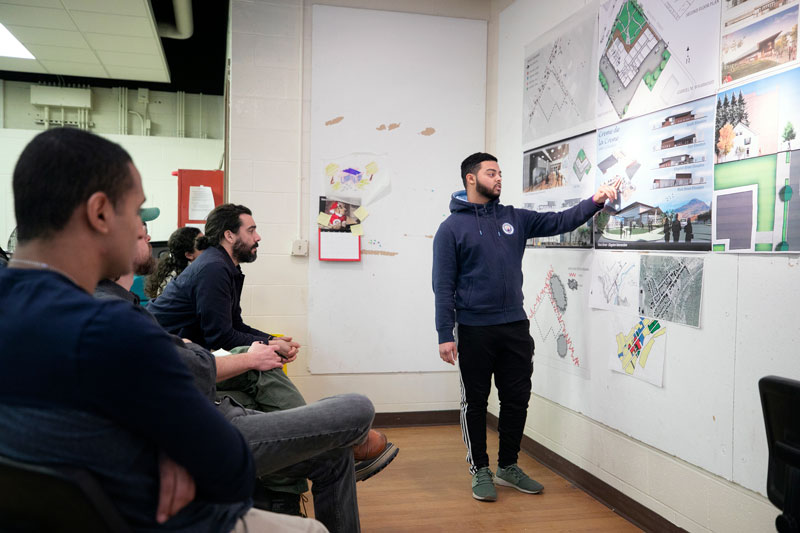 Students and faculy in architecture classroom