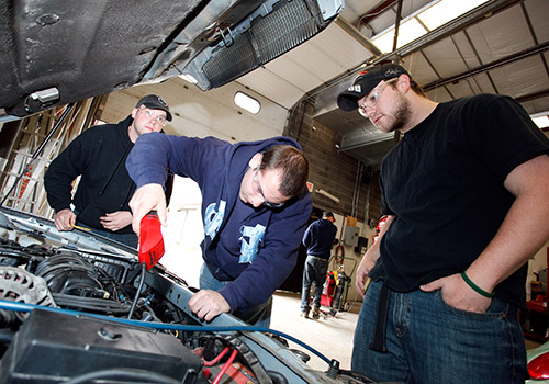 Students working on a car