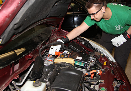 Student working on a car