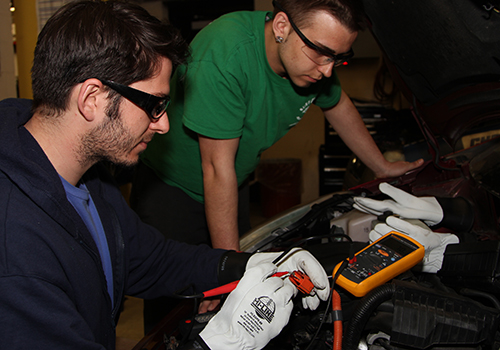 Students working on a car