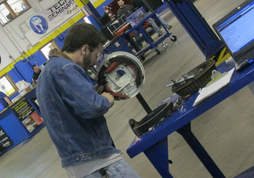 Student working on drum brakes