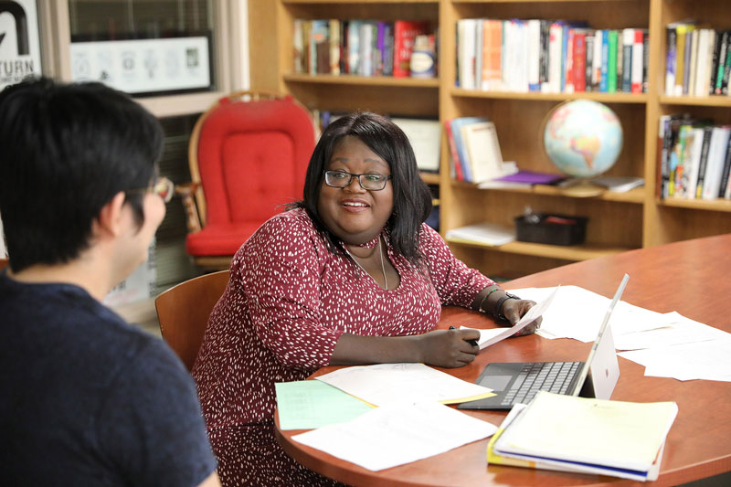 Business faculty member meeting with student