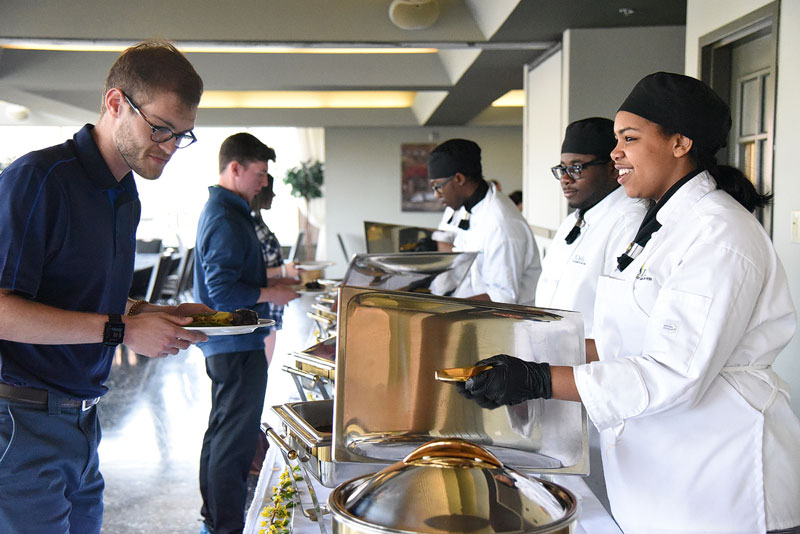 Culinary students in student-run restaurant on campus
