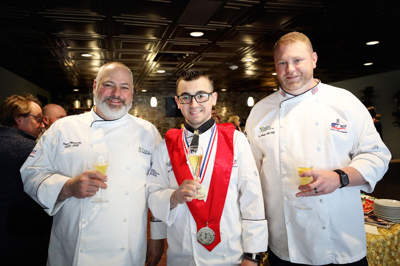 Award winning culinary student and two faculty members