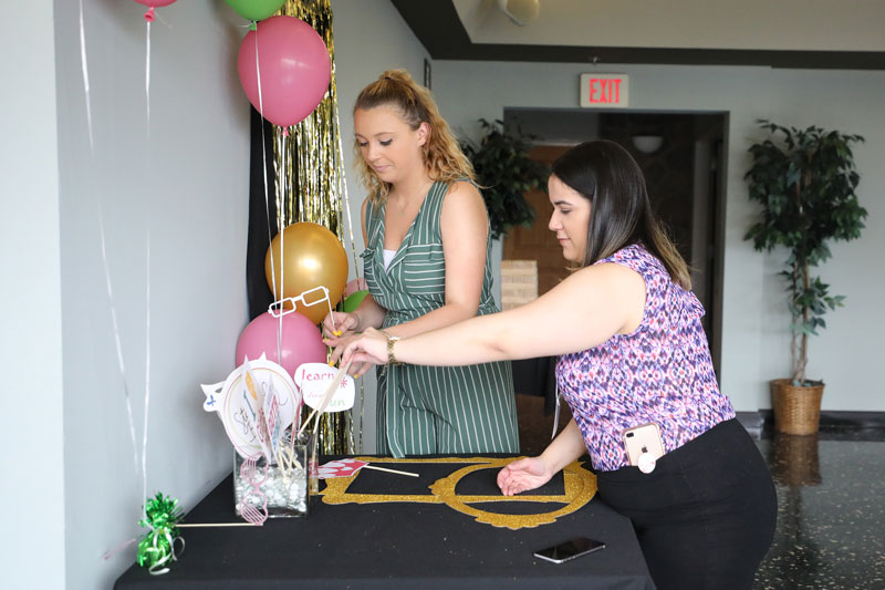 Students arranging decorations on a table