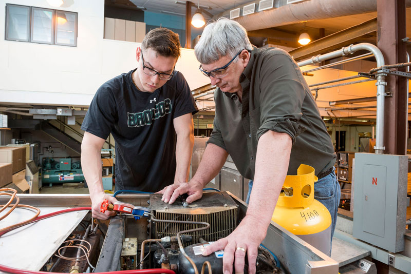 Student and instructor in lab