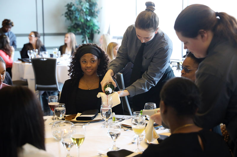 Student serving in student restaurant