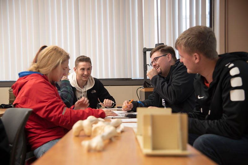 Students talking at table