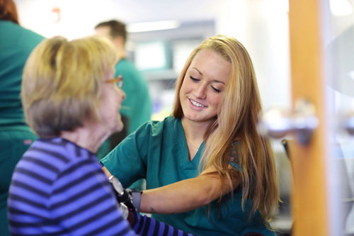 Student working with patient