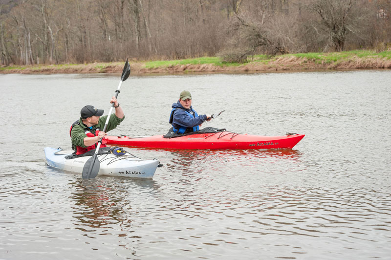 Students paddling in kayaks
