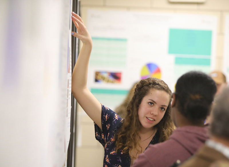 Students having conversation in classroom