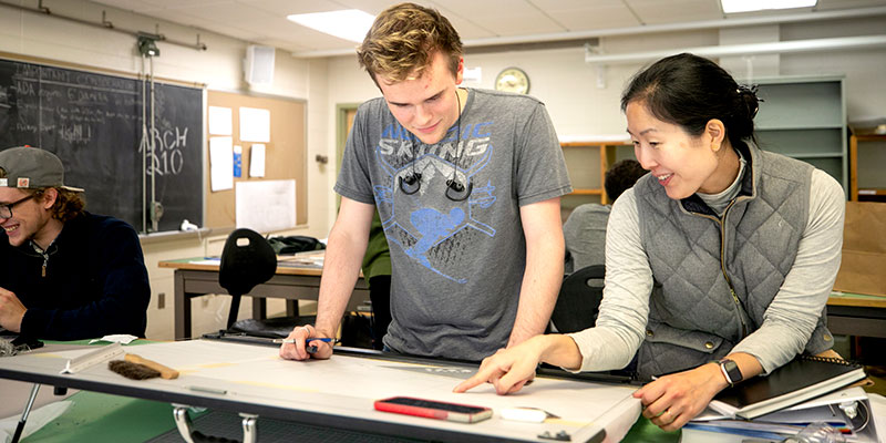 Architecture lab faculty explaining concept to student