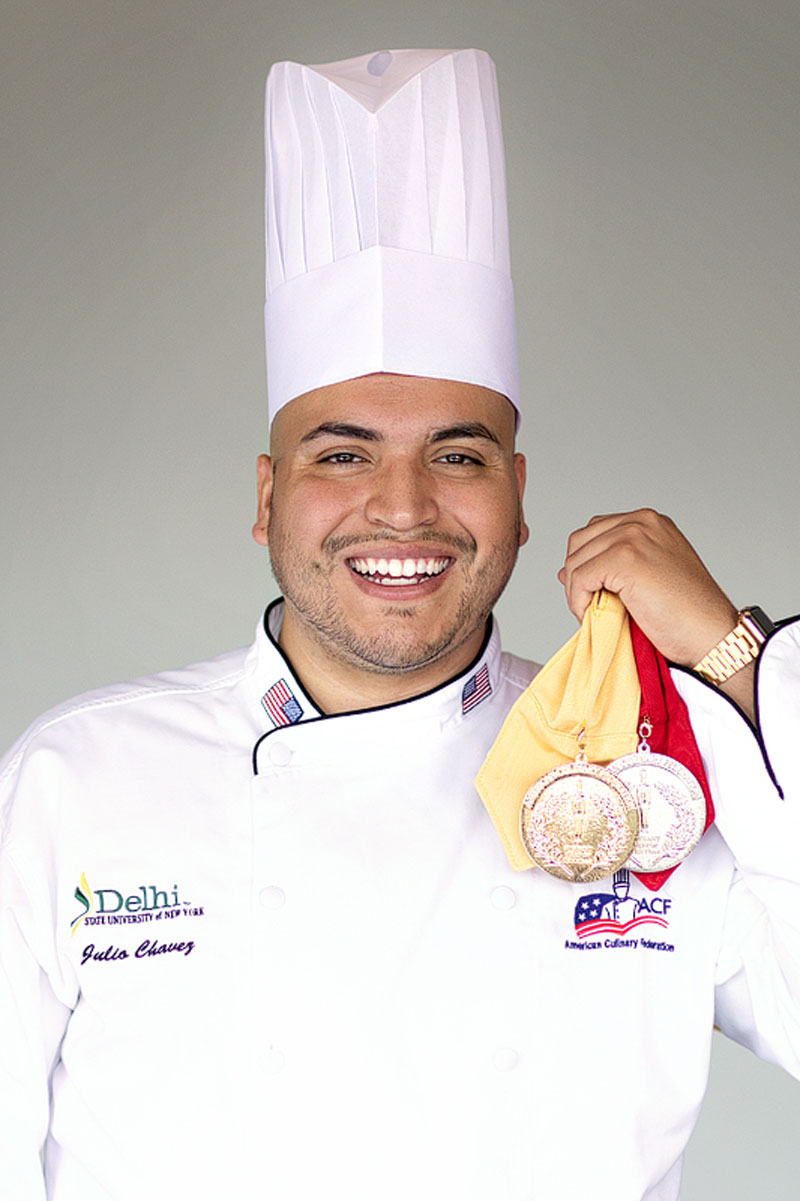 Award winning student displaying medals