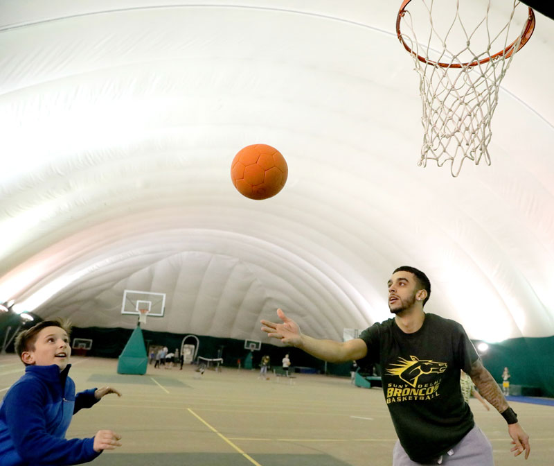 Students playing basketball 