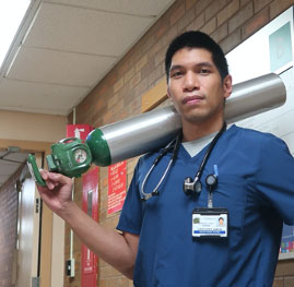 Jeff Rainforth Holding a SUNY Delhi banner