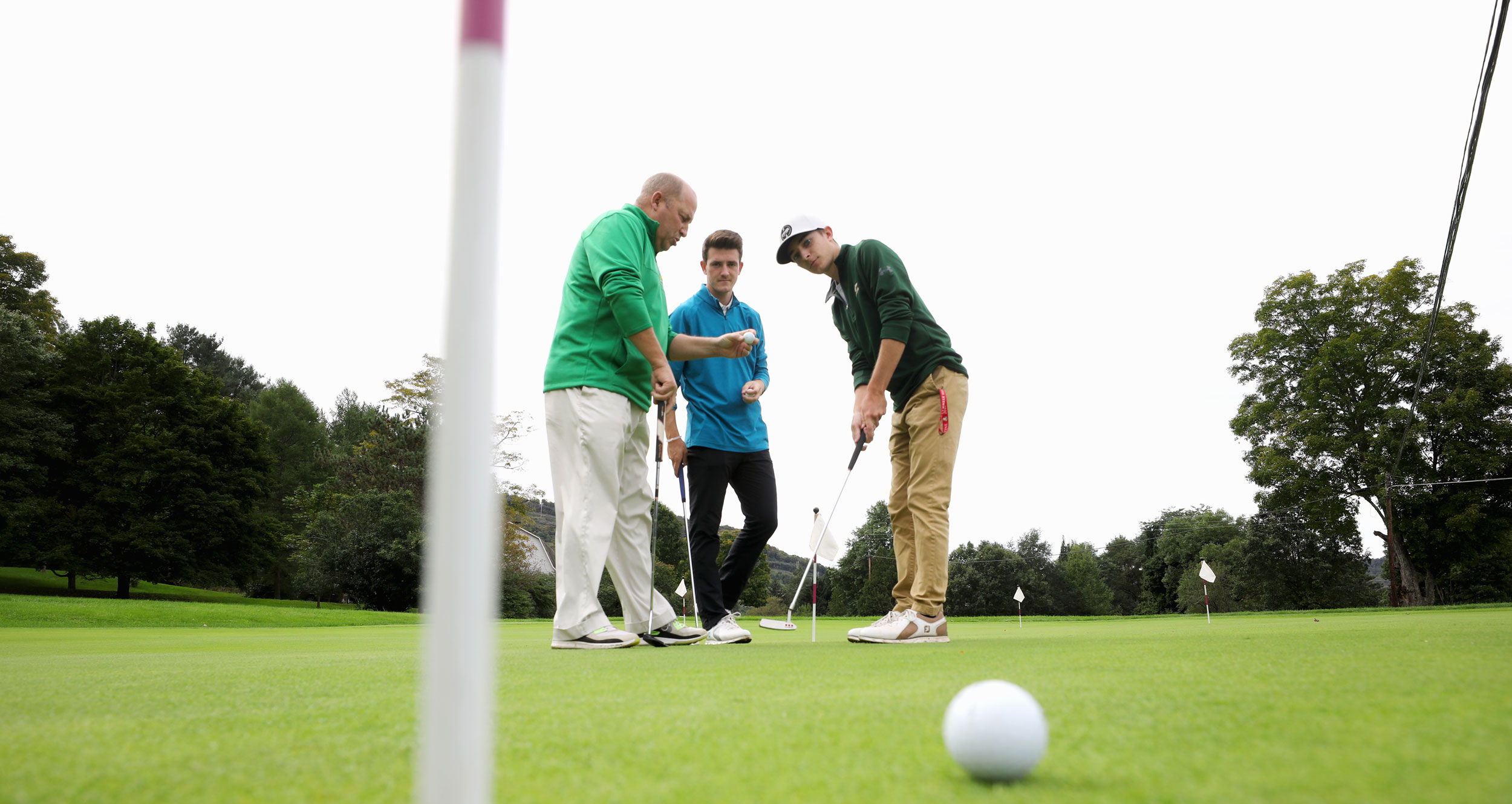 Students and golf instructor