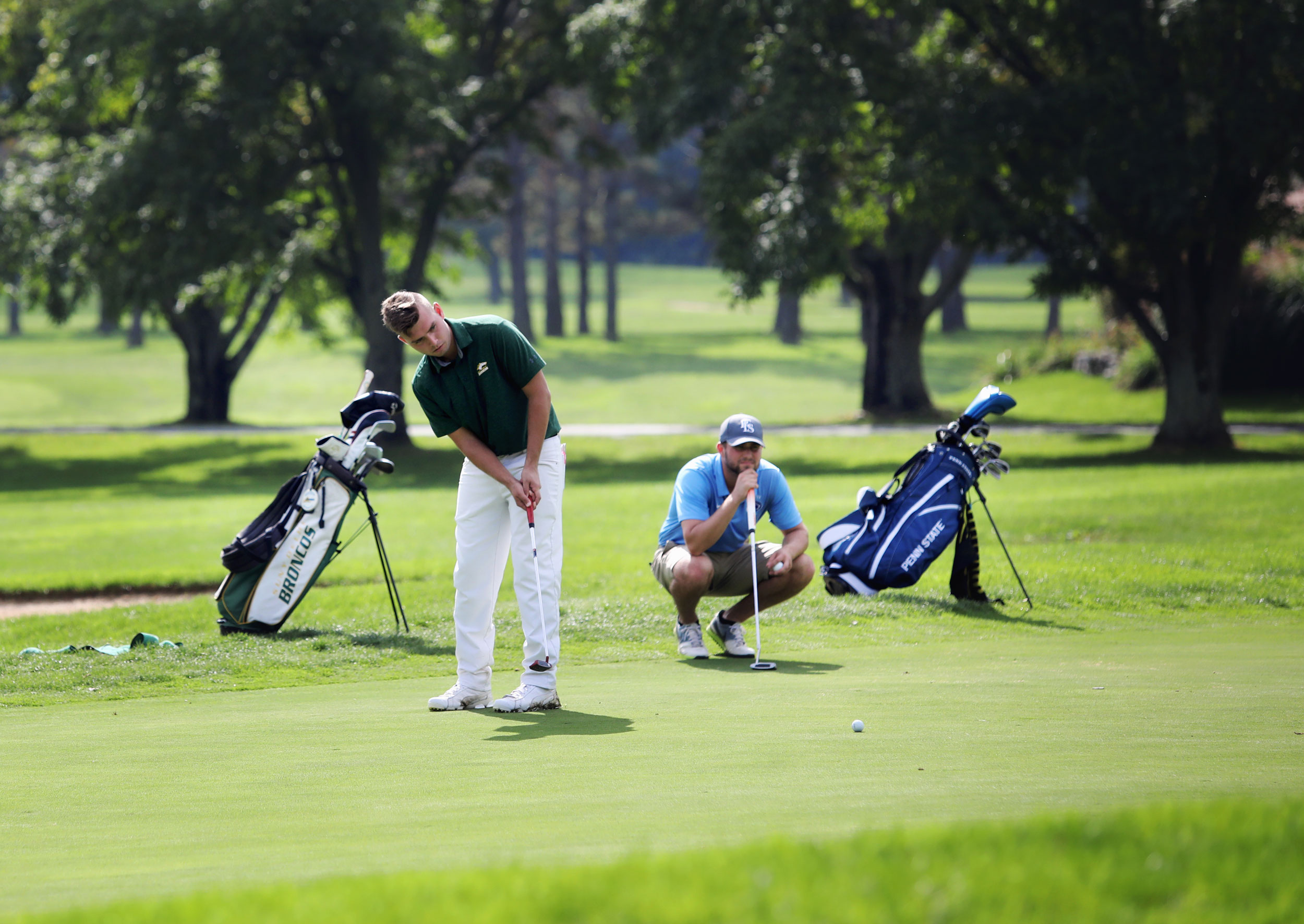 Student golfing