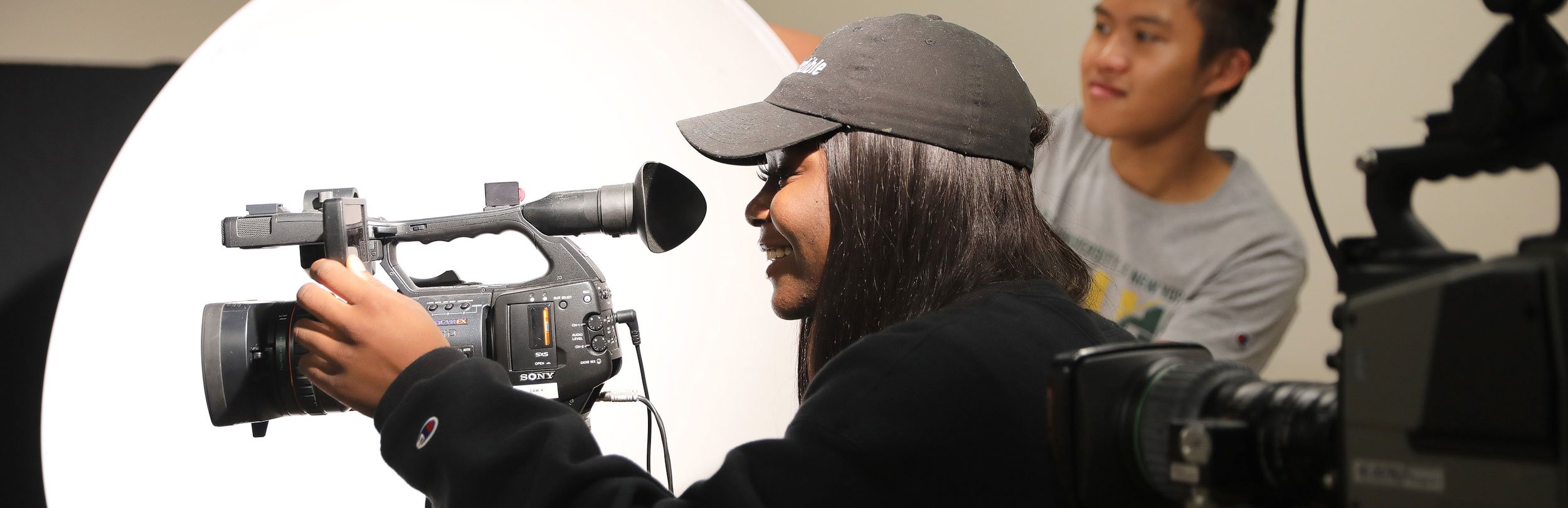 Student with a video camera