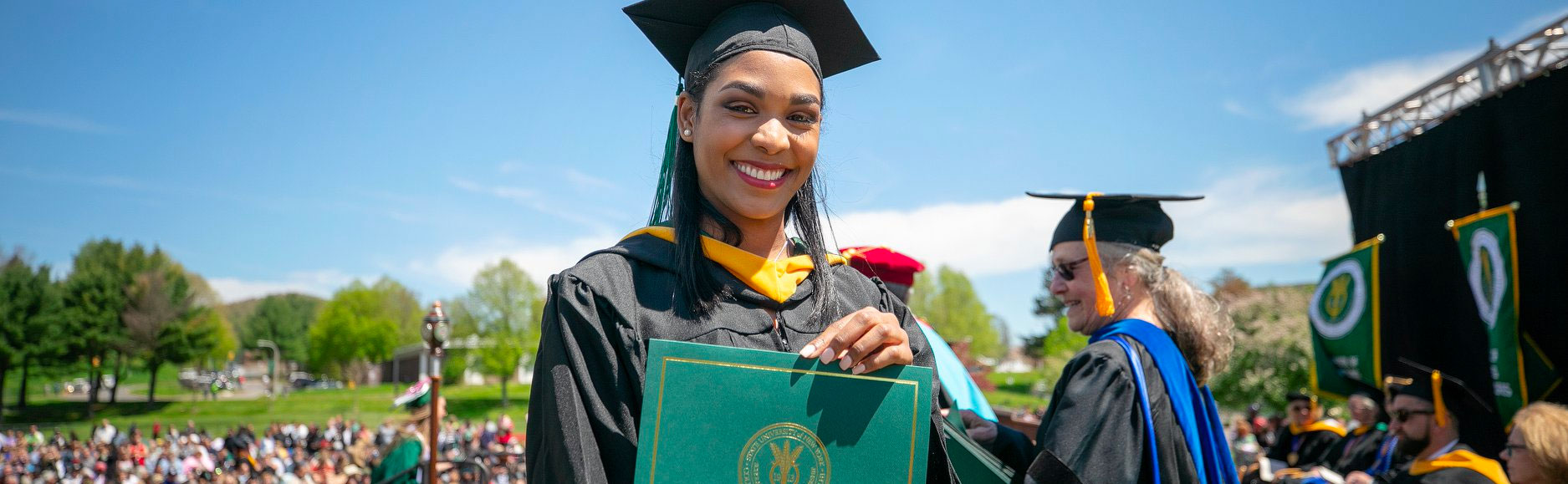 Graduating Student Holding Diploma