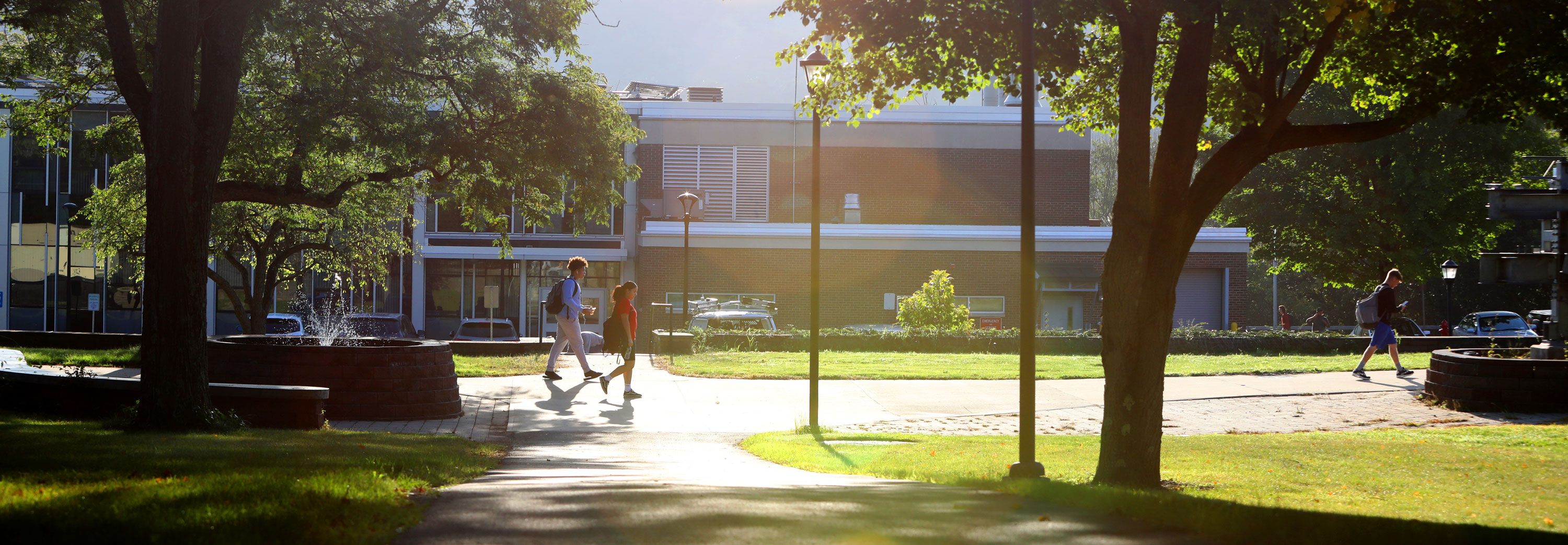 Students walking on campus grounds