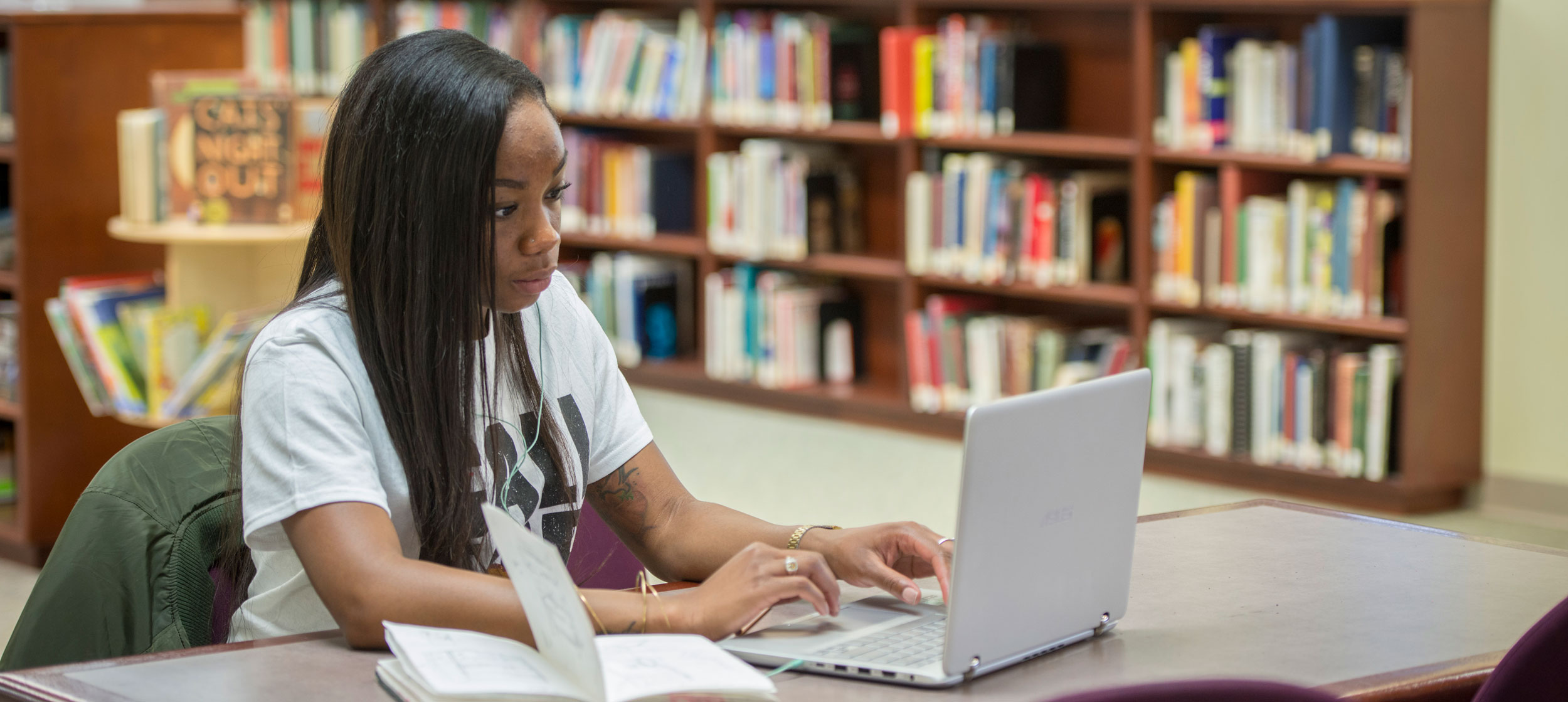 Student at computer on desk